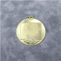 The First Step on the Moon 18KT Gold Eyewitness Pendant    (Franklin Mint, 1969)