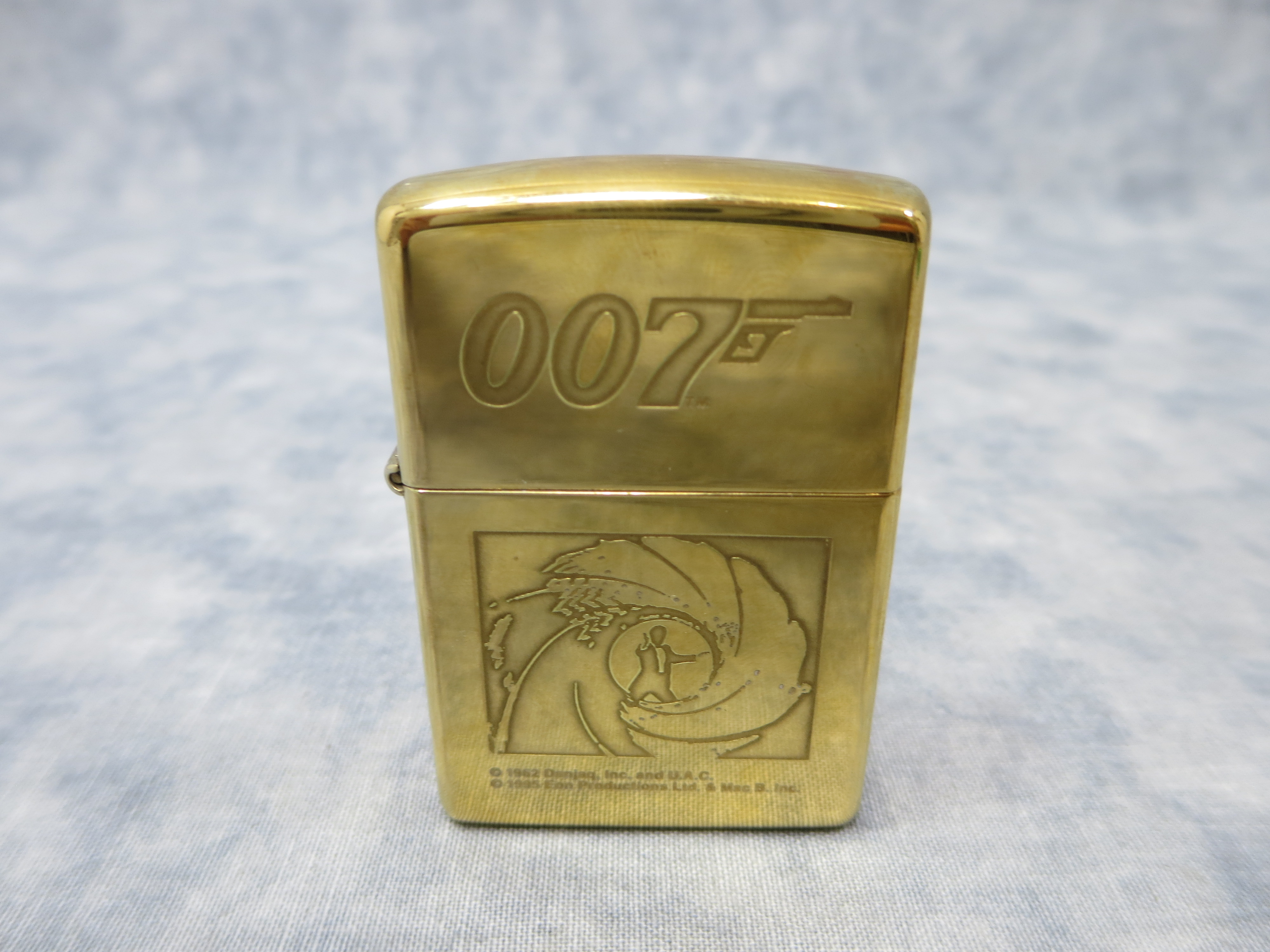 How much is 007 JAMES BOND Brass Lighter (Zippo, 1996) worth? | iGuide