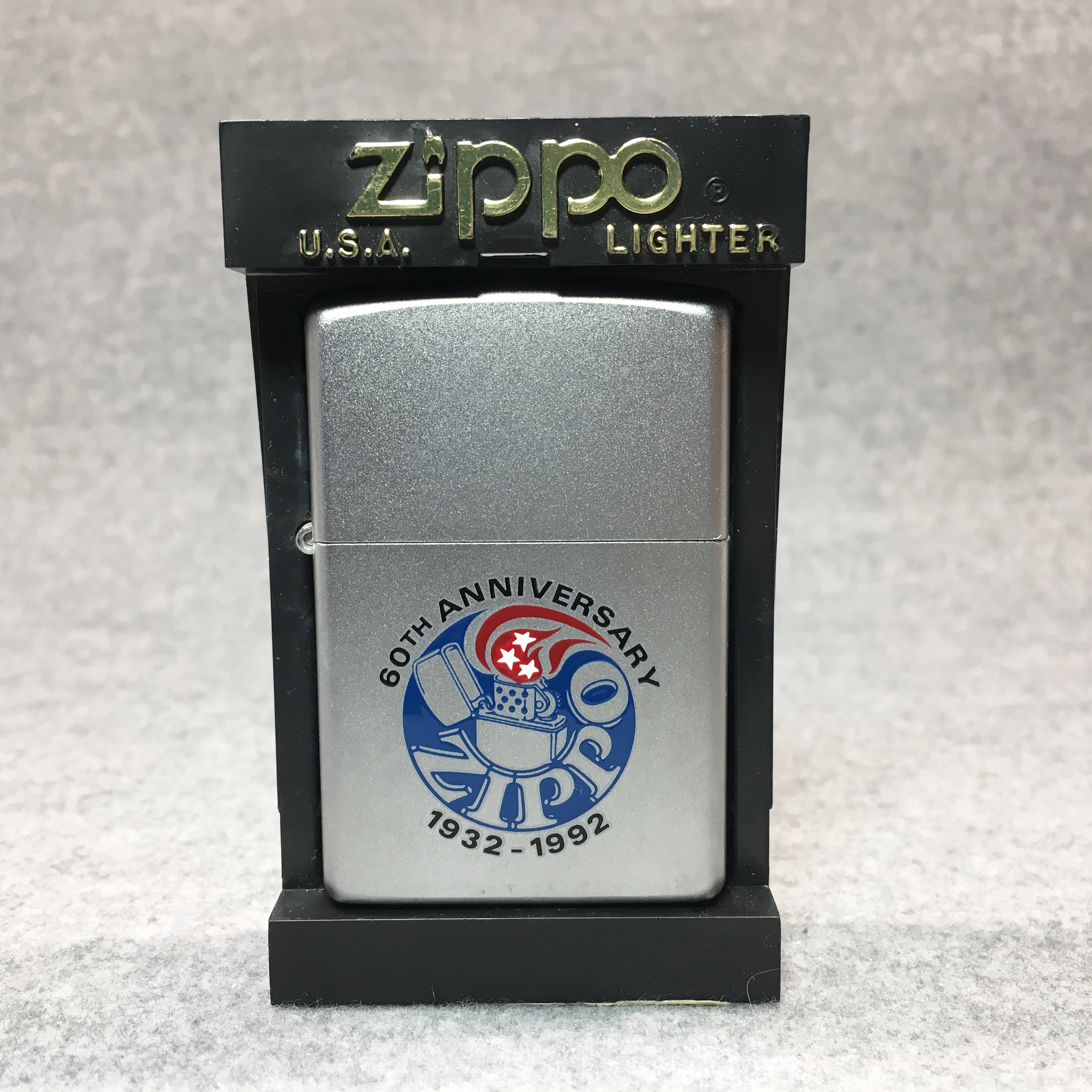 How much is ZIPPO 1932-1992 60TH ANNIVERSARY Satin Chrome Lighter